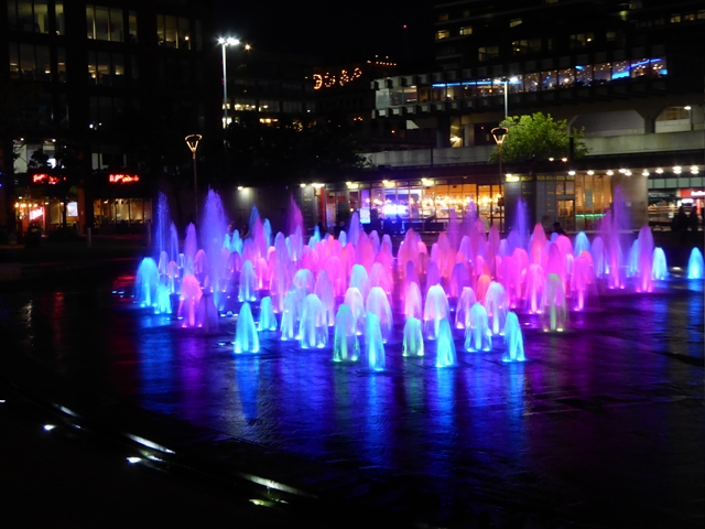 The fountains in Piccadilly Gardens by night