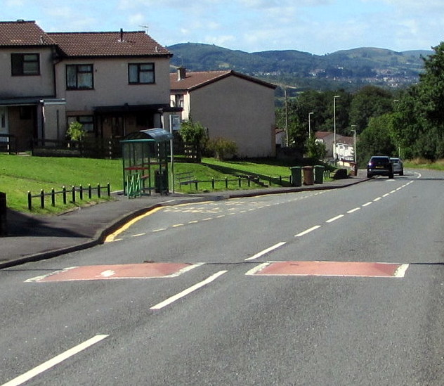 Addison Way speed bumps near a bus stop and shelter, Graig-y-rhacca