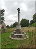 TM3992 : War memorial in the grounds of St Michael's church, Geldeston by Helen Steed
