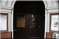 View of the entrance doors of the Brockley Jack pub from Brockley Road