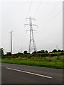 H9320 : The North-South Interconnector crossing Tullynavall Road by Eric Jones