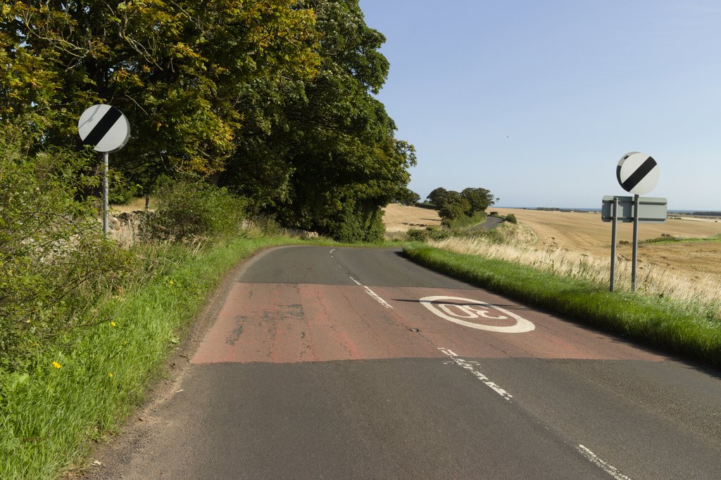 national-speed-limit-signs-on-the-a198-mark-anderson-cc-by-sa-2-0