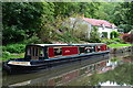 Moored narrowboat and canalside house at Murhill