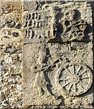 SU5570 : Bucklebury church: man-and-wheel carving by Stefan Czapski