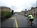 Bus stop and cyclist on Blackburn Road (A666)