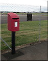 Queen Elizabeth II postbox at the perimeter fence of Gloucestershire Airport, Staverton