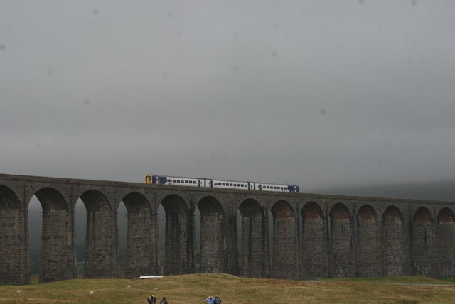 View of a Class 158 train crossing the Ribblehead Viaduct from the Whernside Trek