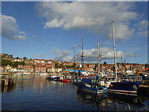 NZ8910 : Boats in Whitby Harbour by Alpin Stewart