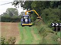 SK6819 : Hedge cutting at Shoby bends by Andrew Tatlow