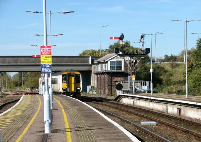 A Diesel multiple unit passing the signal box