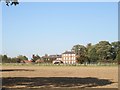 Over  field  to  Rowley  Manor  former  rectory  now  hotel