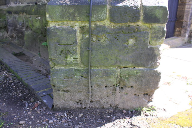 Benchmark on tower buttress of St Wilfrid's Church