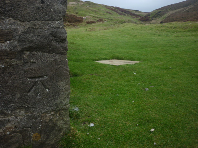 Bench mark on the shooting hut at Mossdale