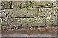 NX9719 : Benchmark on stone in New Road wall by Roger Templeman