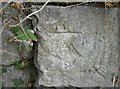 Battered benchmark on the bridge