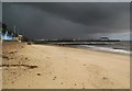 Clacton-on-Sea: Kings Promenade beach and the Pier under a glowering sky