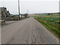 Road approaching its junction with the A95 and B9103 roads at Mulben