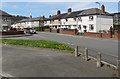 Grass semicircle and concrete posts on a Pontymister corner