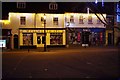 Wellworth It! and M & Co. at night, Christmas 2016, Witney, Oxon