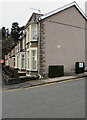 Dark green cabinets on an Ystrad Mynach corner