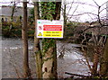 Notice on a bank above the Rhymney River, Ystrad Mynach