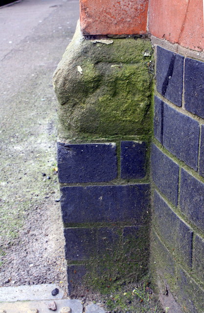 Benchmark on building at junction of Nugent Street and Tudor Road
