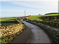 Wall enclosed minor road near Humebyers