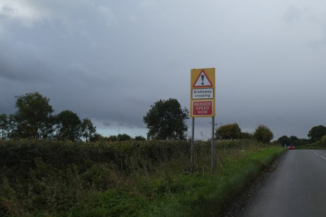 An unusual warning sign of a bridleway crossing