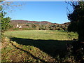 View across a harvested hay field towards Slieve Gullion