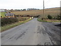 Minor road and Millheugh Bridge crossing Oxnam Water