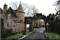 NS5587 : Entrance arch and lodge, Ballikinrain Castle School by Alan Reid