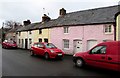 SO0328 : Pink house, red vehicles in Brecon by Jaggery