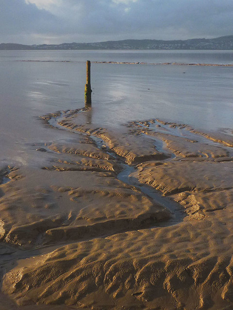 Old mooring post at low tide, Silverdale Cove