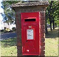 Postbox number LE10 22 in brick pillar on Rugby Road