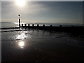 SZ0890 : Bournemouth: groyne № 9 in silhouette by Chris Downer