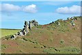 Long lens shot of Hazel Tor from the SW Coast Path on Cathole Point, South Devon