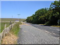 Road heading north, typical Caithness stone fence on the left