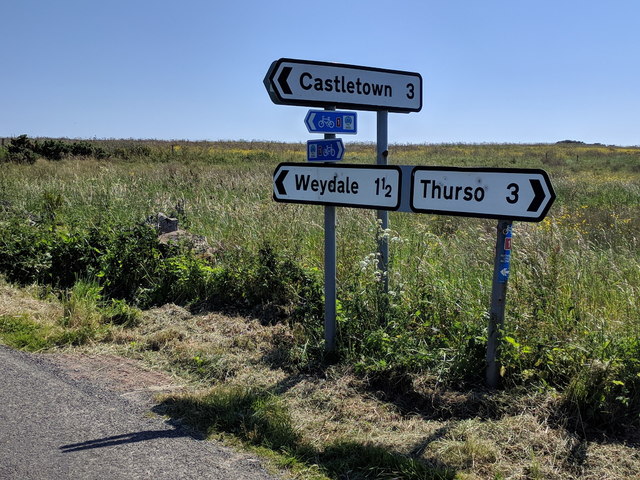 Road signs including those for National Cycle Route 1