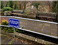 Child supervision notice near benches, Brecon