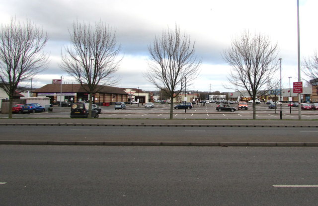 Tree-lined southern edge of Newport Retail Park