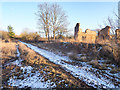 Raisby Way passing ruined building