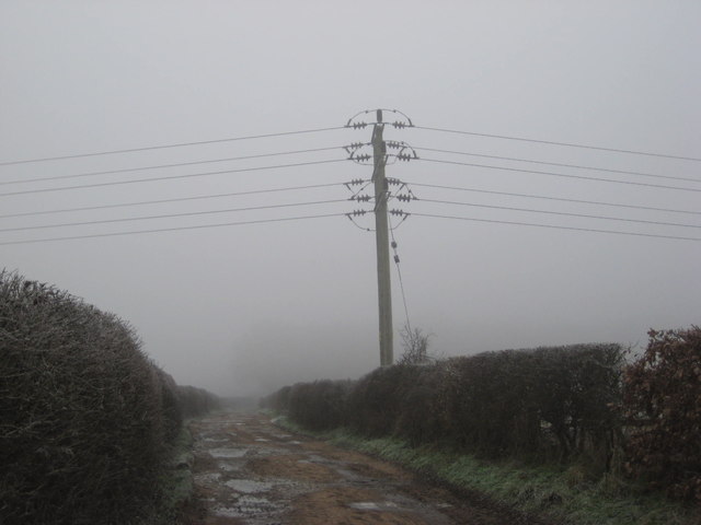 Power line looming out of the fog