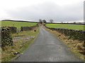 Wall-lined Wham Lane heading towards Lower Wham