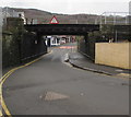 ST0894 : Low railway bridge over the B4275 in Abercynon by Jaggery
