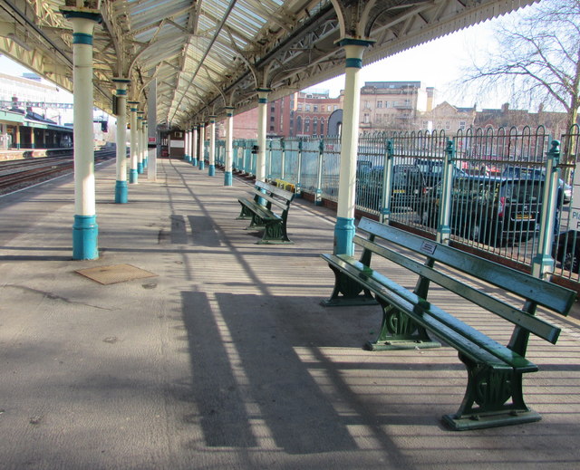 Dark green benches on platform 1, Newport railway station