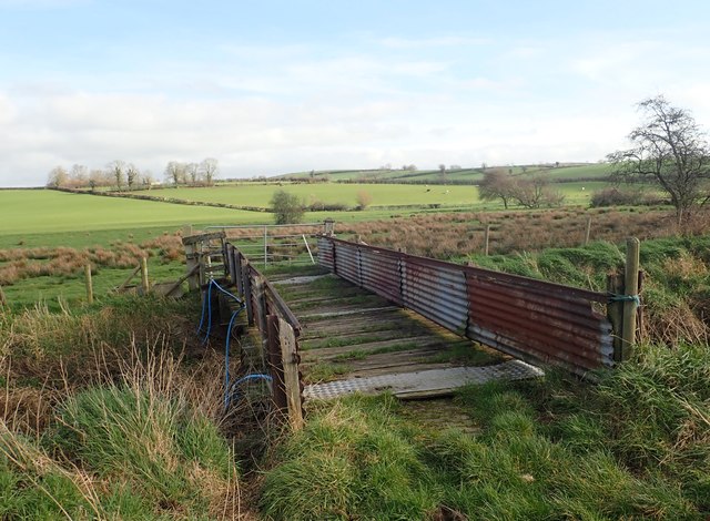 A timber and iron sheeting bridge... © Eric Jones :: Geograph Ireland