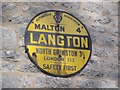 Old circular AA sign in Langton