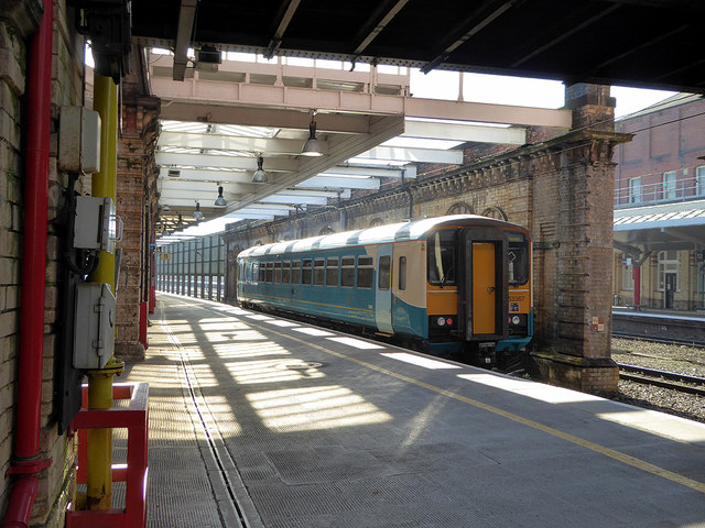 A single car class 153 unit departs from Crewe