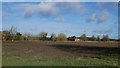 Panorama of field with house in background