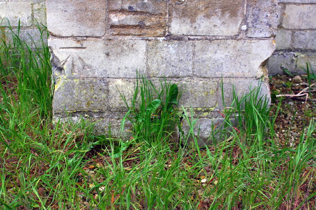 Benchmark on buttress of All Saints' Church